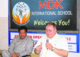 Lawrence Frey, a senior functionary of the University of Cambridge International Examination, addresses mediapersons at the launch of MDK International School at Sirsa