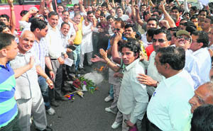 Goldsmiths and jewellers burn an effigy of Finance Minister Pranab Mukherjee in Kangra on Thursday. 