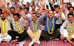 Members of the PHE Workers Welfare Association hold a demonstration in support of their demands in Jammu on Thursday