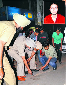 The police examines the crime spot where Neetu (inset) was shot by unidentified assailants in Jalandhar on Thursday