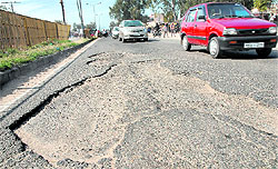 Motorists negotiate potholes on the Jalandhar-Kartarpur road