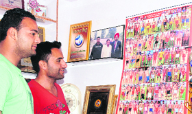 Youths take a look at a collage in Mandi Ahmedgarh.