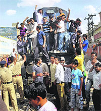 Supporters of BJP MLA Rajendra Rathore stop a train protesting his arrest, in Bikaner on Thursday