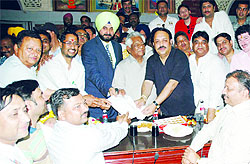 Local Bodies Minister Chunni Lal Bhagat along with Industries Minister Anil Joshi hands over appointment letters to employees of the MC in Amritsar on Friday