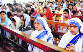 Devotees offer prayers on the occasion of Good Friday at the Catholic Church in Chandigarh on Friday.