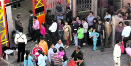 Tourists queue up at Jhoola Ghar for a cable car ride to Gun Hill.