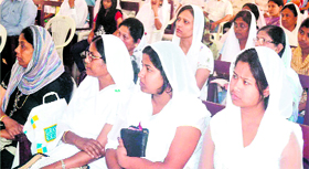 Christian devotees listen to preachings of a priest at the Reformed Presbyterian Church in Haridwar.