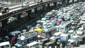 Traffic bottlenecks are common in the flyover area near the Civil Secretariat in Srinagar during summer. 