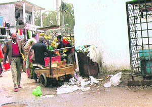 A garbage bin lying uncovered in Mendher town. 
