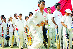 Young cricketers wait for their turn for JDCA trials at Burlton Park in Jalandhar on Friday