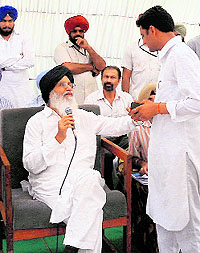 Chief Minister Parkash Singh Badal interacts with a youth in Muktsar on Friday