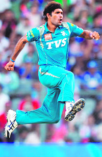 Pune Warriors Ashok Dinda celebrates the wicket of Mumbai Indians Ambati Rayudu during their match at the Wankhede Stadium in Mumbai on Friday