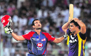 Delhi Daredevils' Irfan Pathan (L) celebrates after hitting the winning runs against Kolkata Knight Riders during their match in Kolkata on Thursday