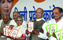 Chief Minister Sheila Dikshit with DPCC president Jai Prakash Agarwal and other senior leaders releases the party manifesto.
