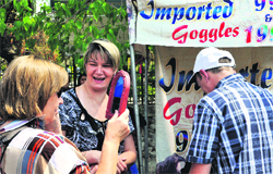 A foreigner tries a pair of imported goggles on a roadside stall in Dehradun