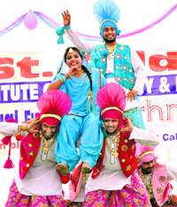 Students of St Soldier Institute of Pharmacy and Polytechnic perform bhangra during their annual function in Jalandhar on Saturday.