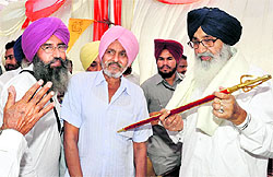 CM Parkash Singh Badal being honoured with a sword in Muktsar