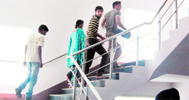 Patients carry oxygen cylinder attached to an ailing child; and (below) the disfunctional lift at Bebe Nanki Mother and Child Care Centre in Amritsar on Sunday.