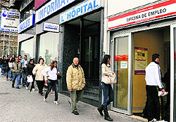 People wait in line at a government employment office in Madrid. The number of workers in Spain officially registered as unemployed climbed by 0.82 per cent from February 2012 to reach 4.75 million, the highest figure since the current statistical series began in 1996, the Spanish labour ministry said