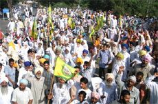 Villagers block the Bathinda-Malout road, protesting against the setting up of the Common Bio-Medical Waste Treatment and Disposal Plant near Burj Mehma village. 