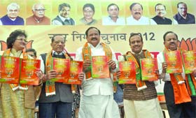 Delhi BJP president Vijender Gupta (second from right) along with senior party leaders Venkaiah Naidu, VK Malhotra, Arti Mehra and Harsh Vardhan releases the election manifesto in New Delhi on Sunday