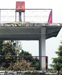 Binoculars covered under a tinned enclosure at Lal Tibba in Mussoorie