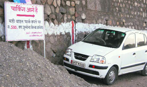 A car parked in the no-parking zone on Mall Road in Mussoorie.