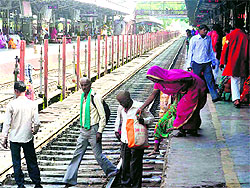 Risking their life, people cross the railway line in Haridwar on Sunday