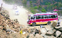 Rocks that keep falling on the narrow highway disrupting traffic on the Mandi-Pathankot highway. 