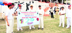 GOC Maj Gen KH Singh gives away the man of the match award to a player after the T20 match in Rajouri.