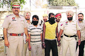 The accused in the double murder case in police custody in Ludhiana on Sunday. photo: Inderjit Verma