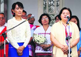 Karen National Union General Secretary Naw Si Pho Ra Sein (R) after meeting Myanmar pro-democracy leader Aung San Suu Kyi (front L) at Suu Kyi's home in Yangon on Sunday