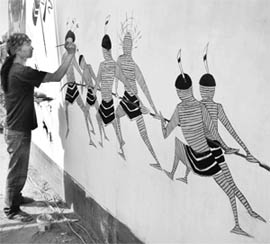 An artist gives final touches to his creation at the Parade Ground, Sector 17, Chandigarh, on Monday. 