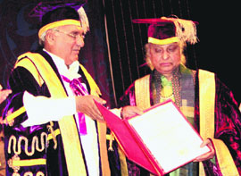 Chief Minister Bhupinder Singh Hooda presents the D.Litt degree to renowned vocalist Pandit Jasraj at the convocation of Maharshi Dayanand University in Rohtak on Monday.