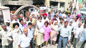 Ex-servicemen protest against the delay in pension in Karnal on Monday. 
