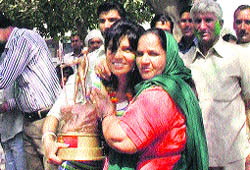 Raj Rani is welcomed in her village by her mother.