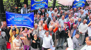 The Pensioners Welfare Association holds a protest at the Deputy Commissioners office in Shimla on Monday.