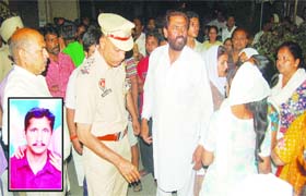 The police at the spot where Daljit Singh (inset), an NRI, committed suicide in Jalandhar on Monday