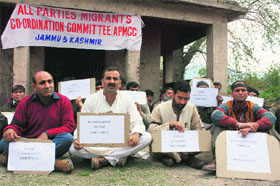 Kashmiri Pandits along with some local Kashmiri residents hold a protest against the illegal sale of the Vaital Bhairav temple in Srinagar on Monday.