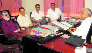 Volunteers of the Save Tawi campaign meet authorities of the State Pollution Control Board in Jammu. 