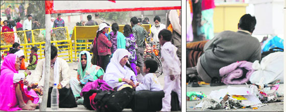 People wait outside the Jammu Railway Station; and (right) a passenger waits near a garbage heap at the station. 