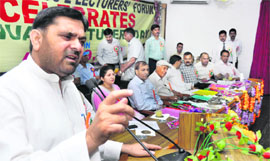 MP Madan Lal Sharma addresses the lecturers at IIIM auditorium in Jammu on Monday.