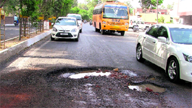 The road leading to the Ferozepur road near the PAU with potholes gives a tough time to commuters while the department concerned is asleep over this grave problem.