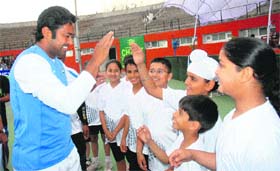 Tennis star Leander Paes interacts with budding players at the CLTA complex, Sector 10, Chandigarh, on Tuesday