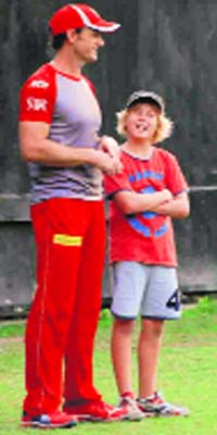 Kings XI Punjab captain Adam Gillchrist with his son at the PCA Stadium, Mohali, on Tuesday