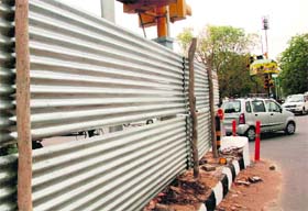 Tin-sheet barricades put up outside the PCA Stadium near the traffic light point on the road separating Phases IX and X of Mohali