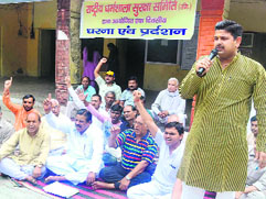 Rashtriya Dharamshala Suraksha Samiti members stage a protest at the City Magistrates office in Haridwar on Tuesday.