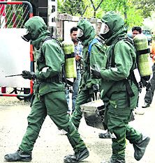 Members of the NDRF team rush with life-saving equipment