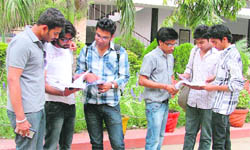 Students engaged in a discussion after the paper of corporate accounting (II) of BCom second year of the PU was put off in Ludhiana