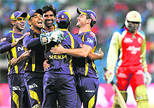 Kolkata Knight Riders celebrate the dismissal of Royal Challengers Bangalores Chris Gayle (R) during their match at the M. Chinnaswamy Stadium in Bangalore on Tuesday. Knight Riders won the match by 42 runs.